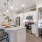Apartments for Rent in Southeast Austin TX - Ariza Easton Park - Kitchen Area with Stainless-Steel Appliances- White Modern Cabinets, and Kitchen Island